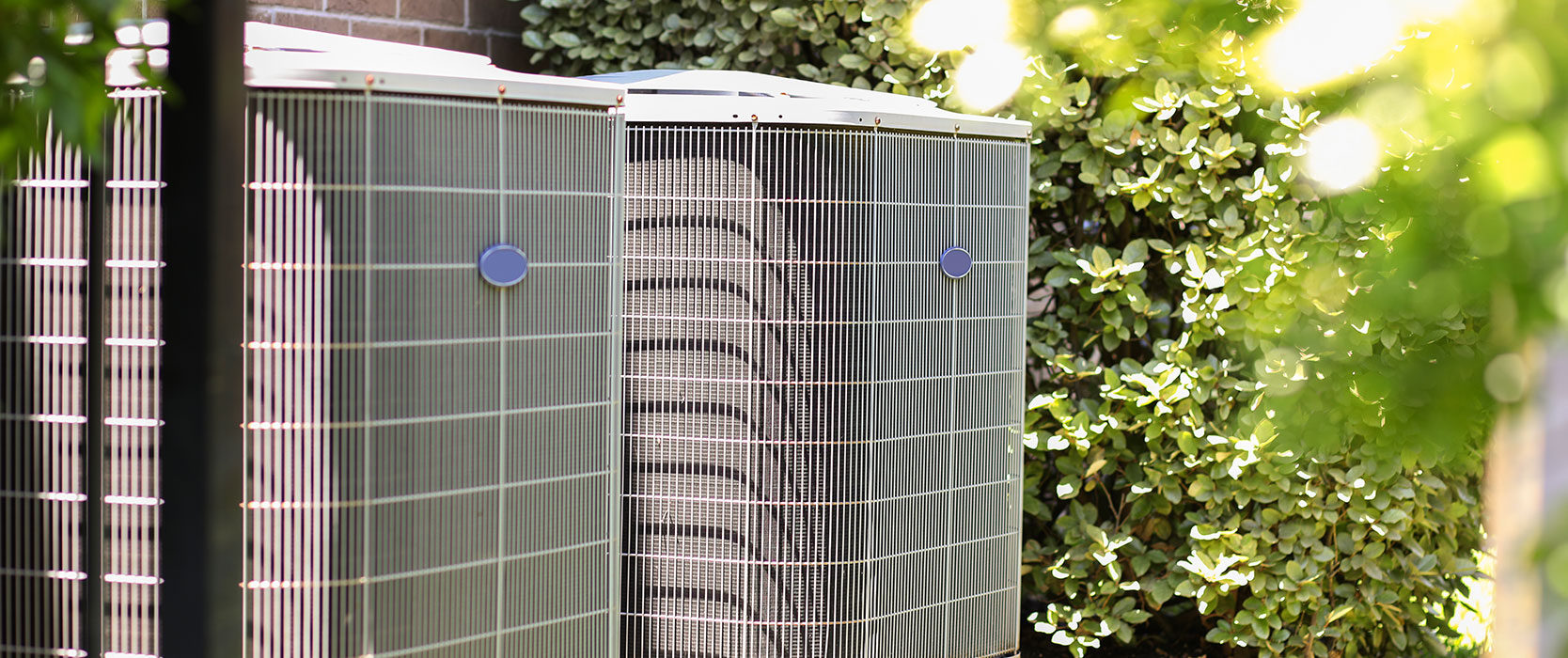 two compressors in a yard.